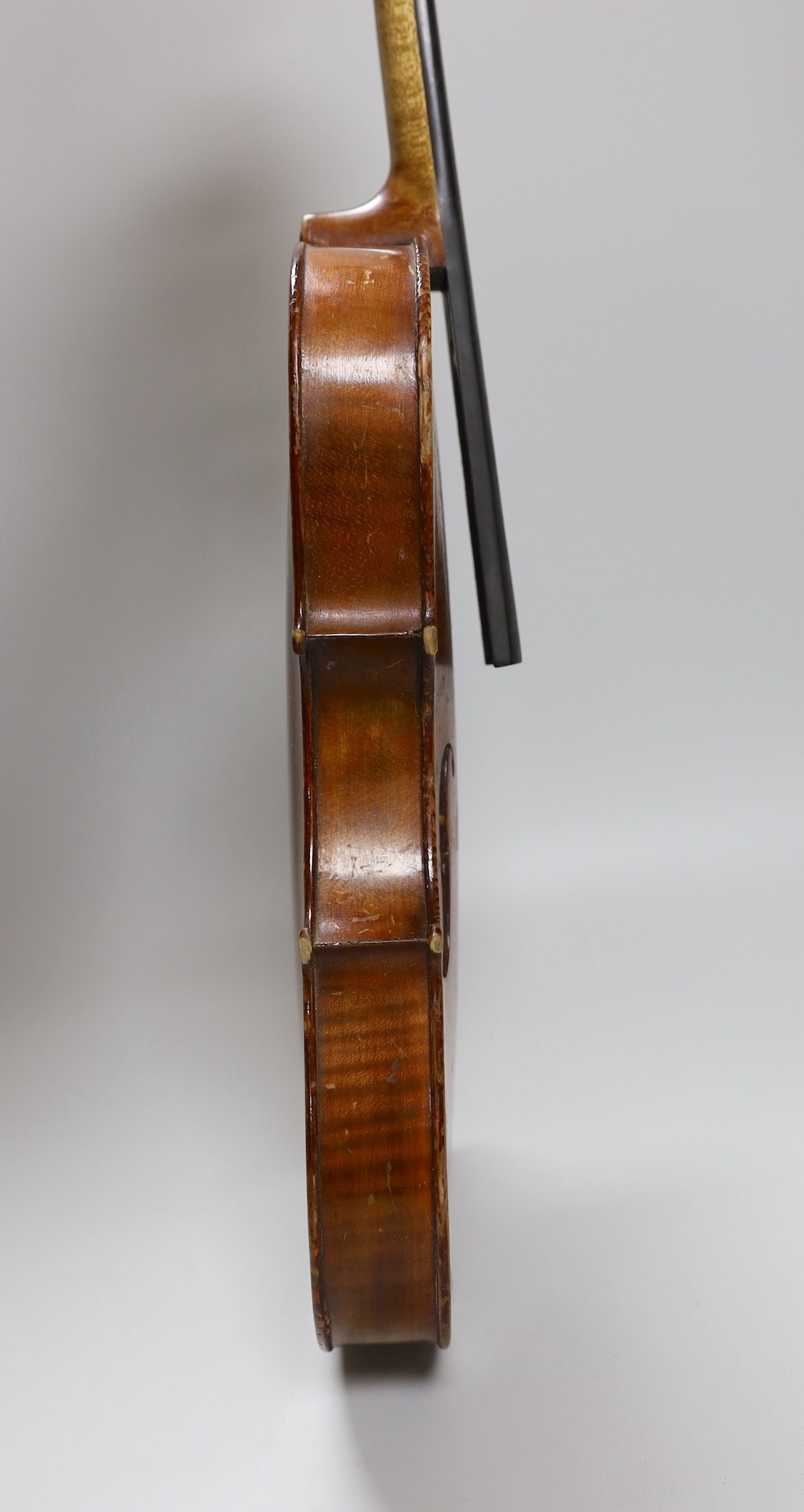 A cased three quarter size violin, labelled E.Coiffier, 56cms long